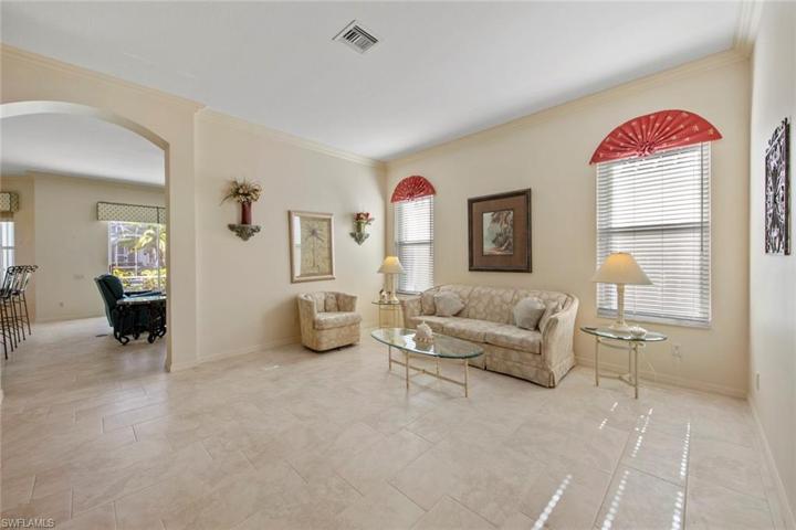 Living room, arched entry leads to family room/kitchen