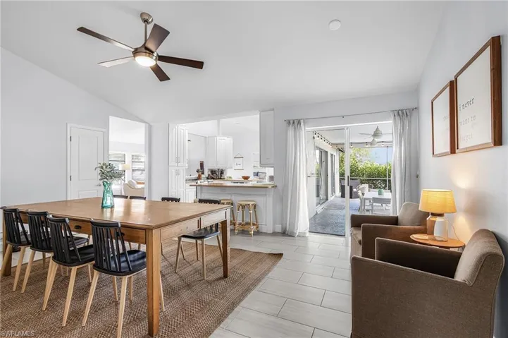 Vaulted ceiling with a contemporary ceiling fan and recessed lighting