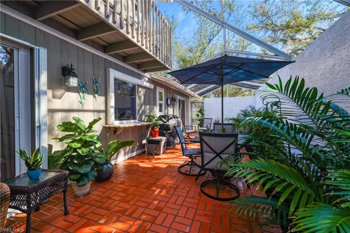 View of patio / terrace with a lanai