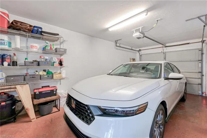 Garage featuring a garage door opener