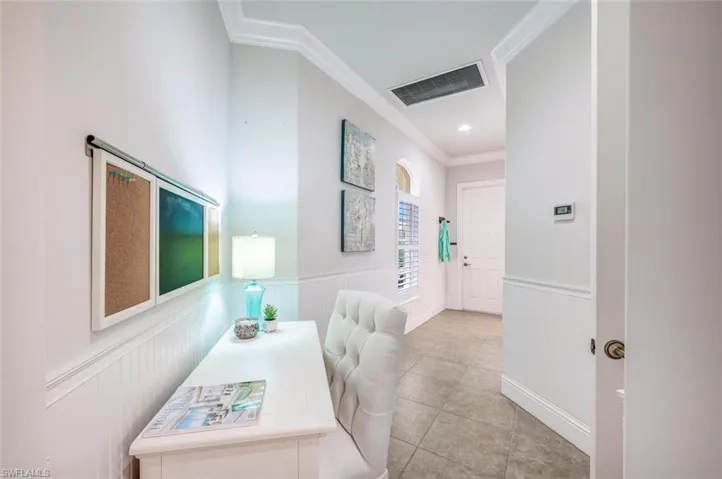 Hallway from Garage, past the laundry is set up as a cubby/desk area.