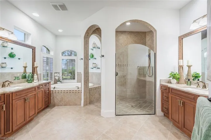 Primary Bathroom, dual sinks, separate tub and shower. No bidet.