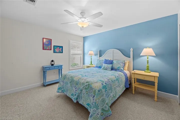 Bedroom featuring carpet and ceiling fan