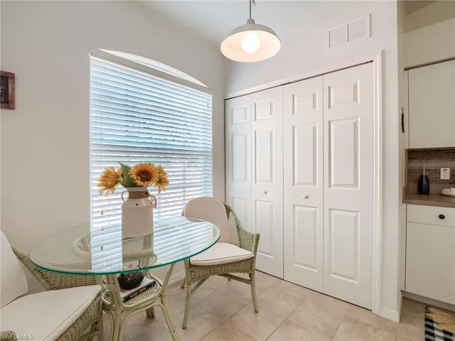 Dining room with light tile patterned flooring