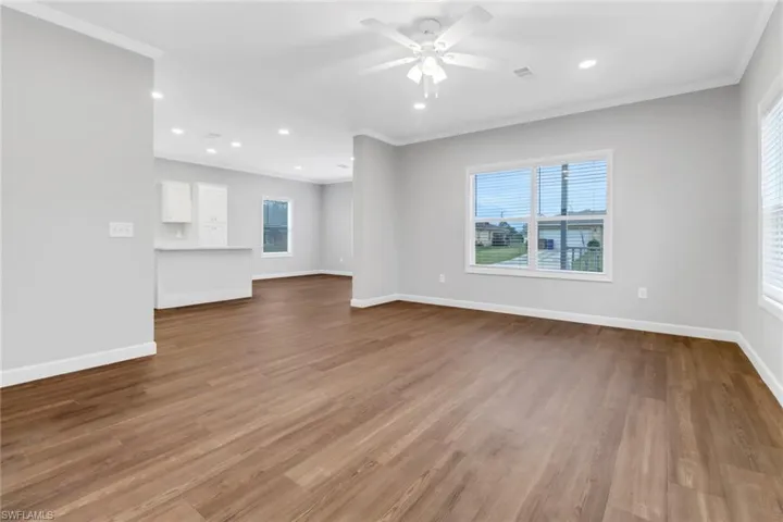 living room view to dining and kitchen