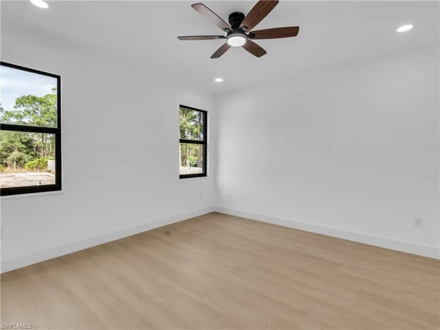 Unfurnished room with recessed lighting, light wood-style floors, and ceiling fan