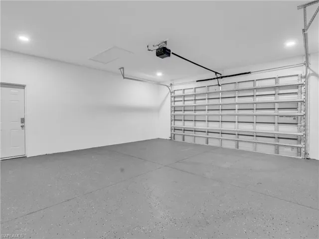 2 Cars Garage  with recessed lighting and a garage door opener