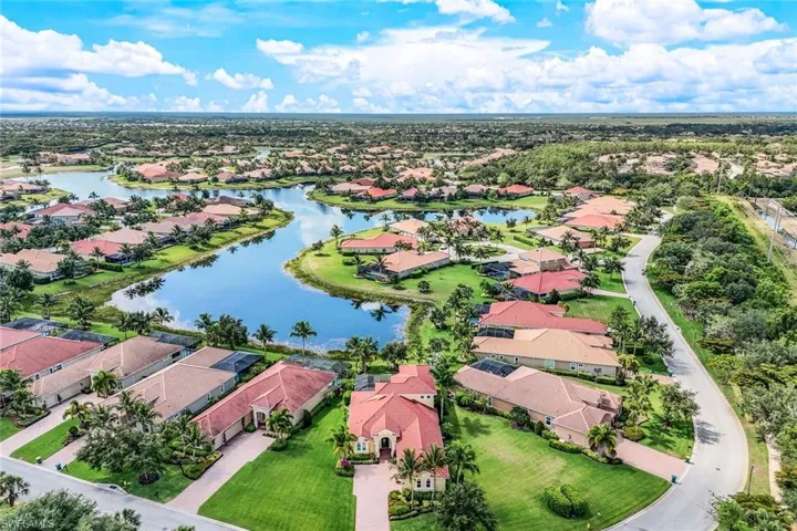 Drone / aerial view with a residential view and a water view