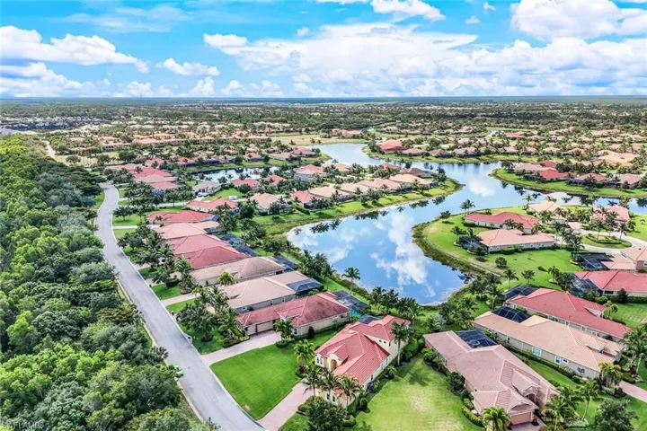 Drone / aerial view featuring a water view and a residential view
