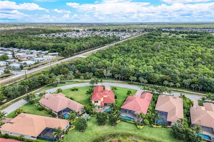 Drone / aerial view with a view of trees and a residential view