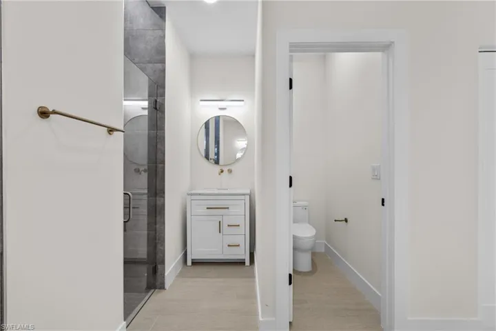 Bathroom with vanity and a shower stall