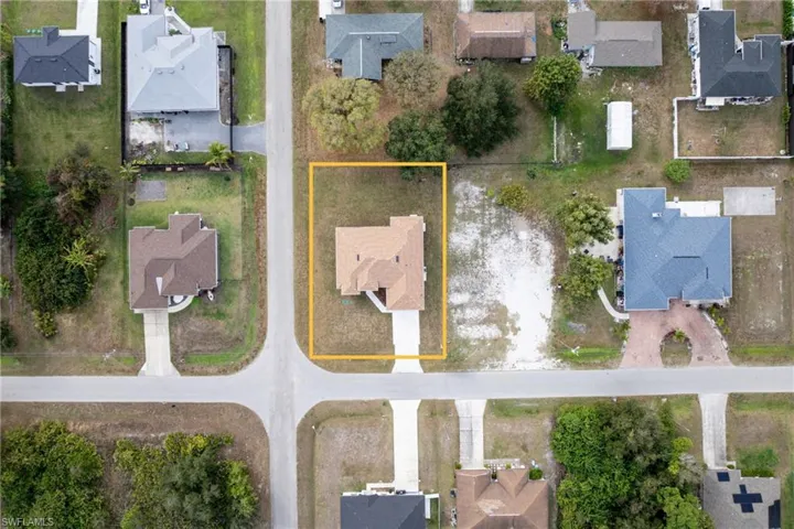 Aerial perspective of suburban area with property boundaries highlighted