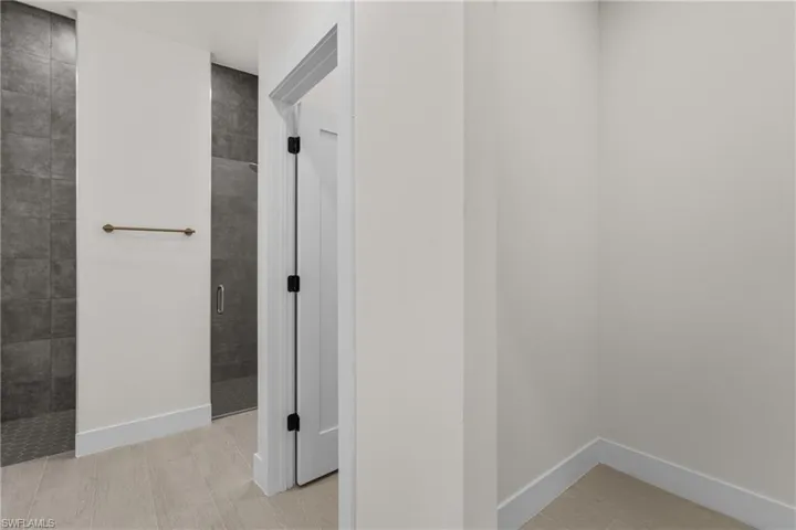 Corridor featuring baseboards