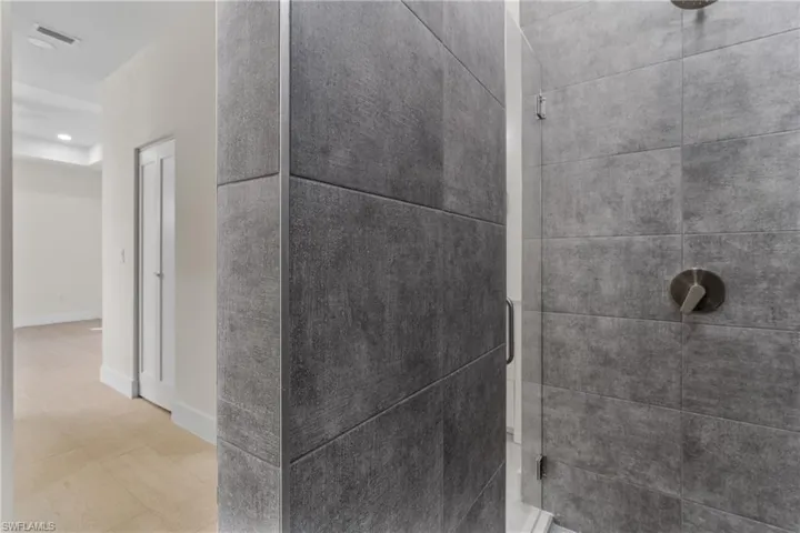 Detailed view of a shower stall and recessed lighting