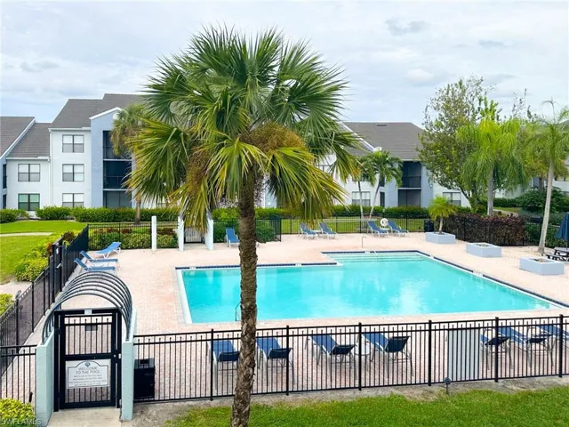 Community pool featuring a patio area
