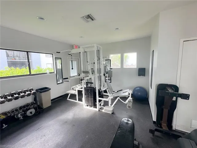 Exercise room featuring recessed lighting