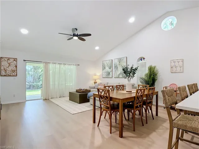 Vaulted ceiling with recessed lighting and a ceiling fan