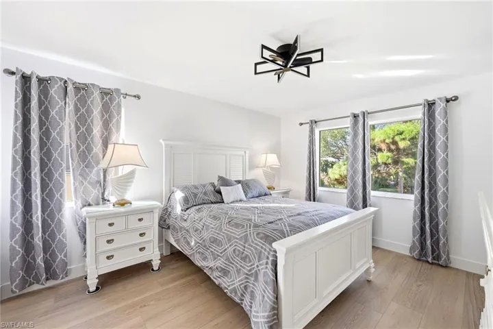 Bedroom featuring light wood-style flooring and baseboards