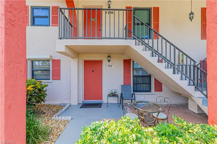 Entrance to property with a spacious patio area