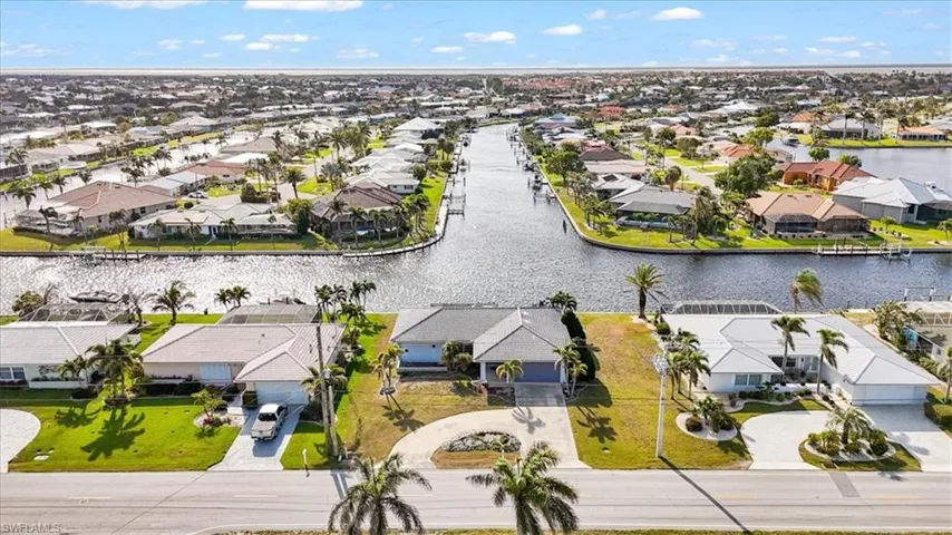 Aerial view of residential area with a nearby body of water