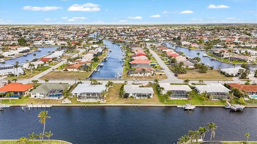 Aerial perspective of suburban area with a large body of water