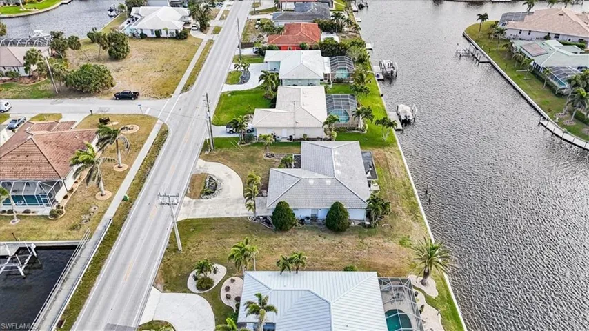 View of property location featuring nearby suburban area and a nearby body of water