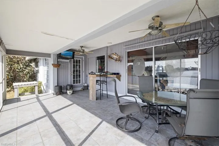View of patio featuring ceiling fan