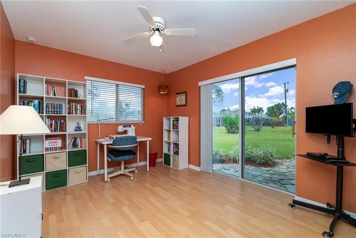 Office with ceiling fan and light wood-type flooring