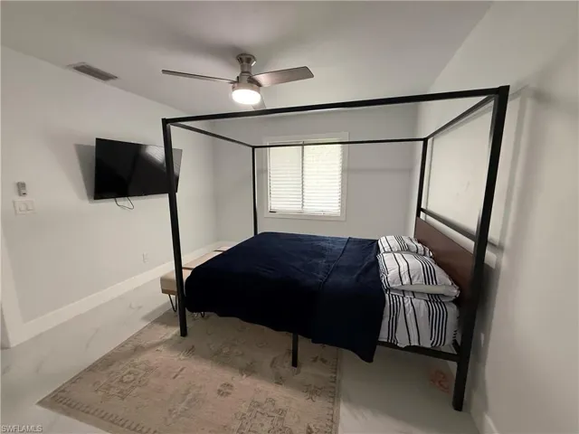Bedroom featuring baseboards and a ceiling fan