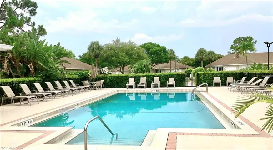 Community pool featuring a patio