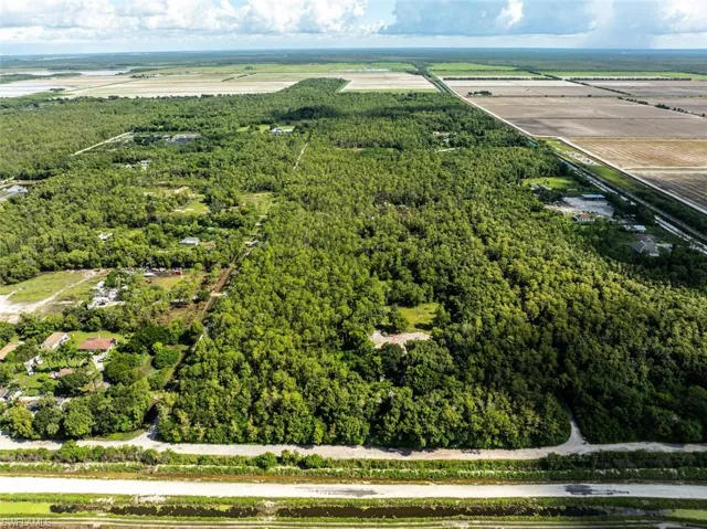 Aerial view of property and surrounding area with rural landscape and extensive farmland