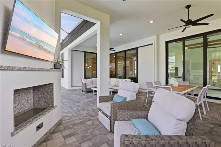 View of patio with a ceiling fan and an outdoor living / dining area