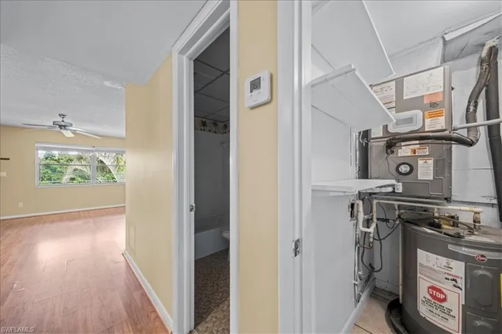 Utility room with water heater and heating unit