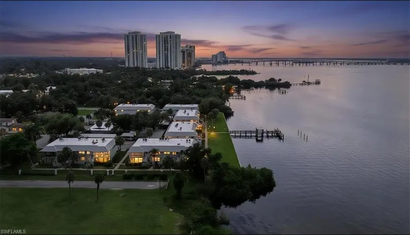 Aerial view at dusk of a water view and a view of city