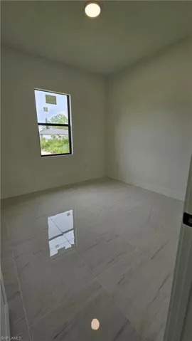 Unfurnished room featuring baseboards and recessed lighting