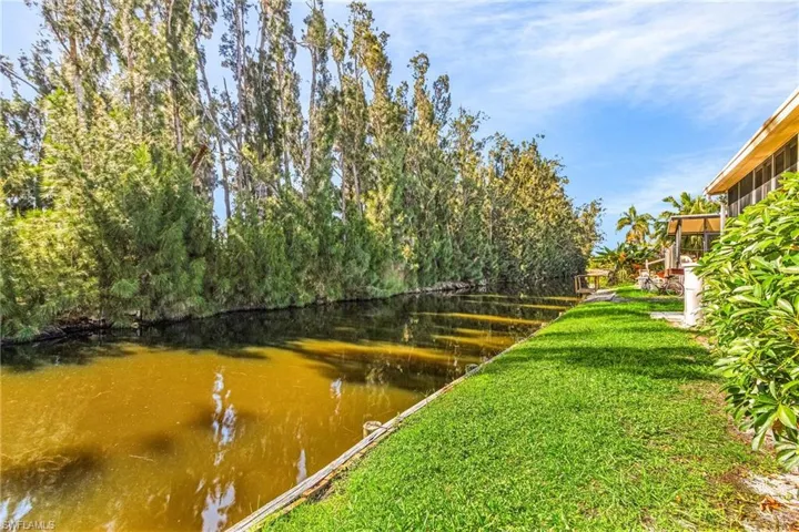 View of yard with a water view