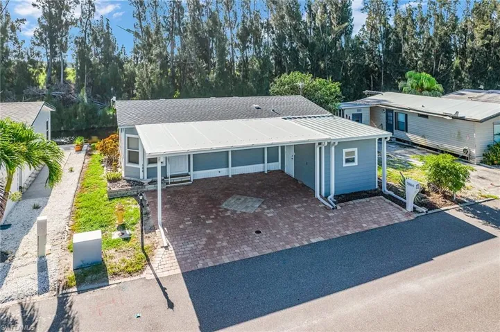 View of front facade with a shingled roof