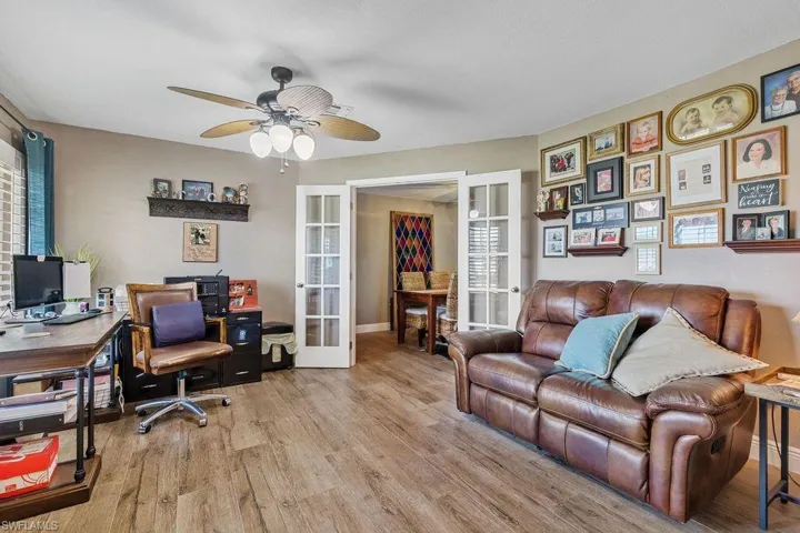 Office featuring french doors, wood-type flooring, and ceiling fan