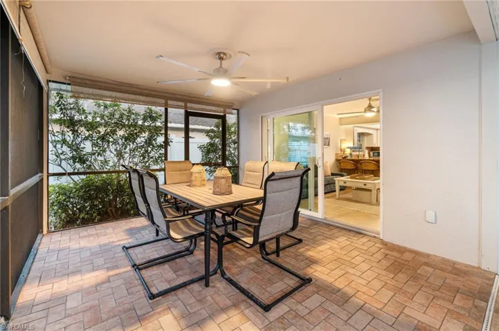Fully covered outdoor dining area with upgraded fan and lighting.