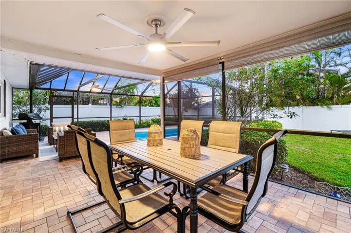Fully covered outdoor dining area with upgraded fan and lighting.