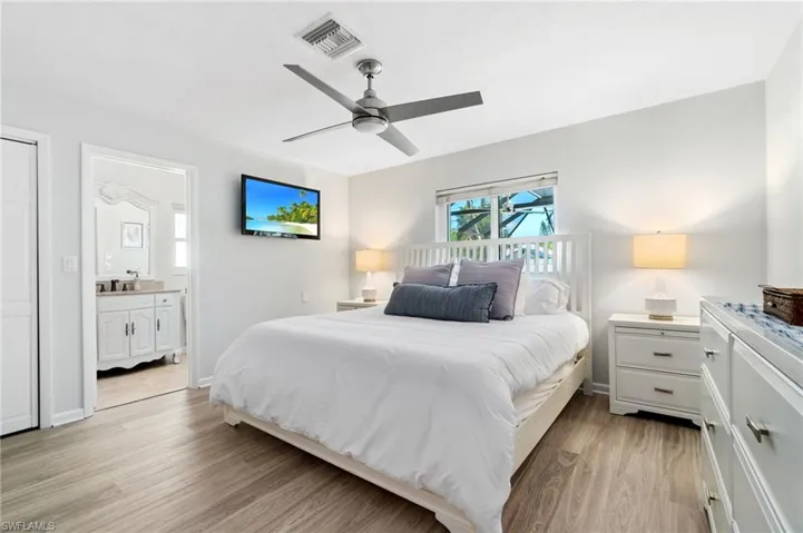 Bright Primary Bedroom en-suite is situated off rear with sparkling pool views.