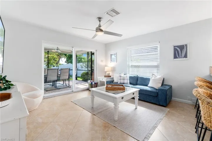 Tiled living room with ceiling fan