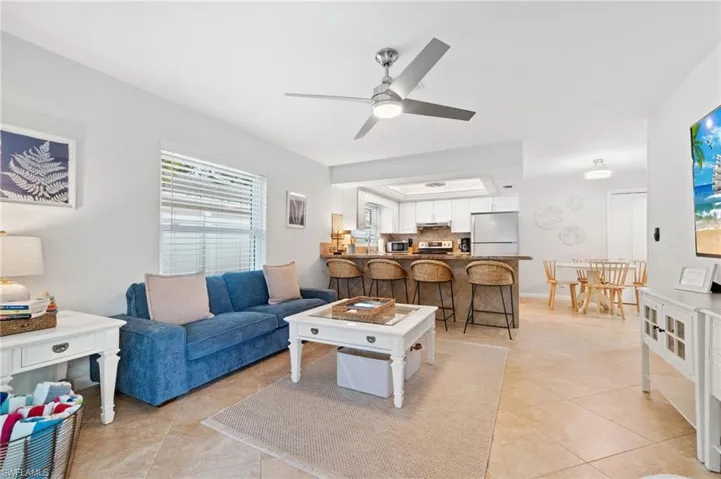 Tiled living room with ceiling fan
