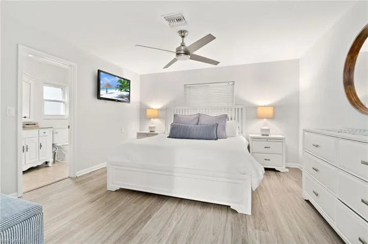 Bright Primary Bedroom en-suite is situated off rear with sparkling pool views.