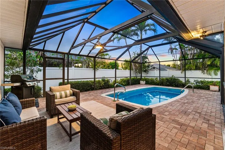 Back screened in pool Patio has 2 separate covered seating areas.