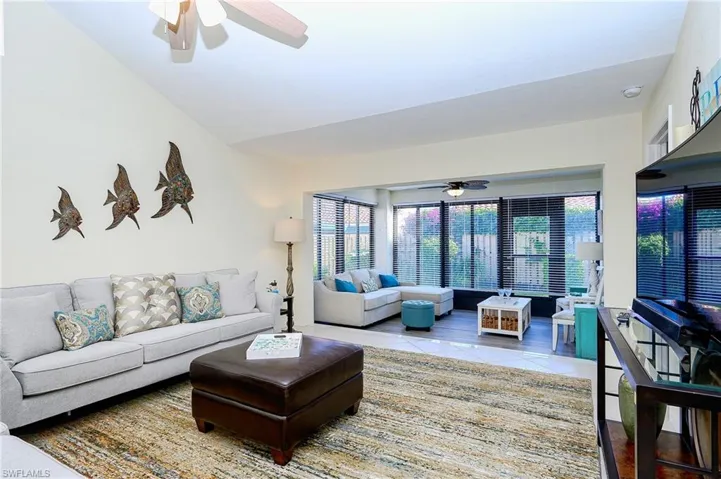 Tiled living area with a ceiling fan