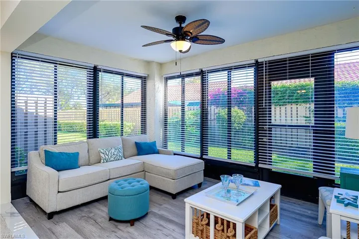 Living room featuring a ceiling fan and wood finished floors
