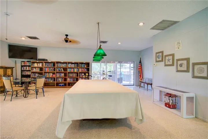 A large community space with Billiards, a Library, and a comfortable seating area