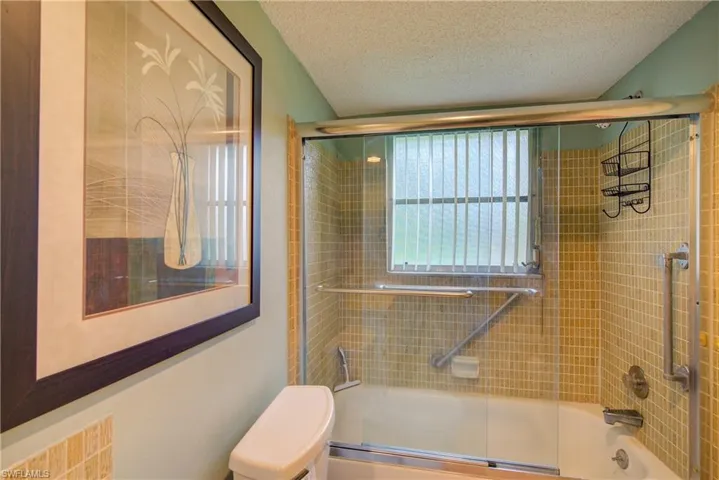 The guest bathroom with a tub/shower combo