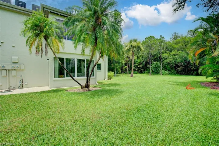 Lush green grass and mature, well kept landscaping